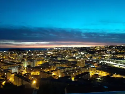 a view of a city lit up at night at Perle in Nice