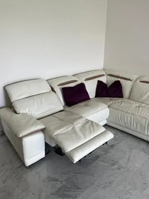 a living room with a white couch and purple pillows at 2 pièces avec terrasse en résidence privée in Nice