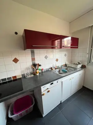 a kitchen with a sink and a counter top at 2 pièces avec terrasse en résidence privée in Nice