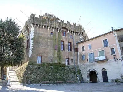 an old castle with a wall and benches in front of it at Apartment Les Trois Caps by Interhome in Cagnes-sur-Mer