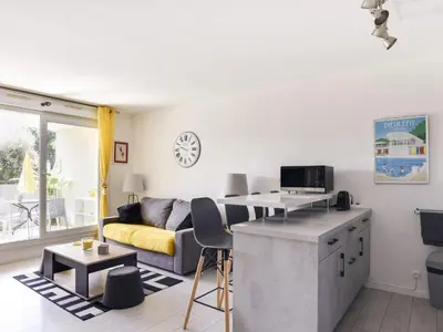 a living room with a couch and a table at Apartment Cimiez Les Pins by Interhome in Nice