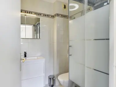 a bathroom with a shower and a toilet and a sink at Apartment Cimiez Les Pins by Interhome in Nice