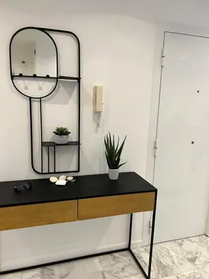 a dressing table with a mirror on a wall at Nice la Belle, city centre 1 bed, 2 terrace, quiet in Nice