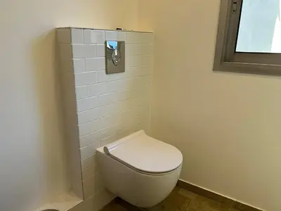 a white toilet in a bathroom with a window at Nice la Belle, city centre 1 bed, 2 terrace, quiet in Nice