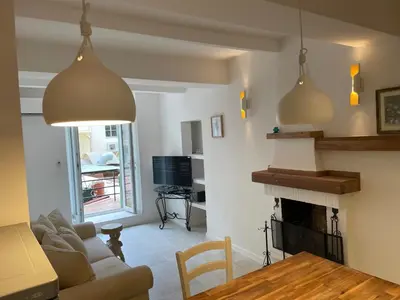 a living room with a couch and a fireplace at Summerhouse 2 bed quiet Old Nice balcony100m beach in Nice