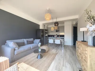 a living room with a couch and a kitchen at Nestor&Jeeves - BLUE PEARL - Port area - Close Old Town in Nice