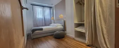a small bedroom with a bed and a window at cagnes promenade in Cagnes-sur-Mer