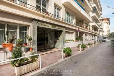 a building with potted plants outside of it at Suite Reine Marie FSHH in Nice