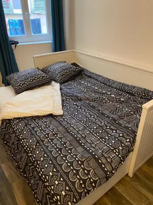 two beds with pillows on them in a bedroom at Vieille ville in Nice