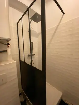 a shower with a glass door in a bathroom at Vieille ville in Nice