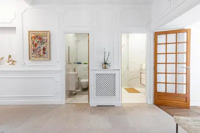 a white bathroom with a tub and a toilet at PROMENADE SEA VIEW - Terrasse vue mer in Nice