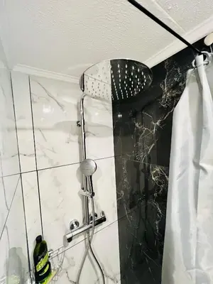 a shower with a shower head in a bathroom at NICE - Central 100m plage- Negresco - IDEAL COUPLE in Nice