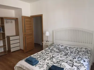 a bedroom with a bed with blue pillows on it at Villa Niçoise.3P. 5 min de la plage in Nice