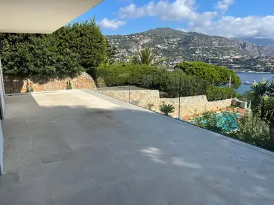 a large patio with a view of the water at Villa LA ALEGRIA in Nice