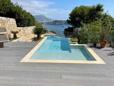 a swimming pool in the middle of a patio at Villa LA ALEGRIA in Nice