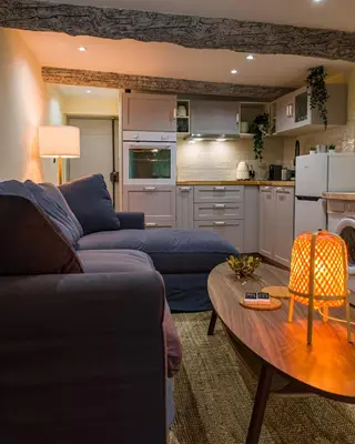 a living room with a couch and a table at Nice Vieille Ville Appartement neuf et cosy, deux chambres, 6 couchages in Nice