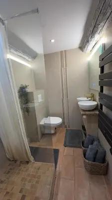 a bathroom with a toilet and a sink at Nice Vieille Ville Appartement neuf et cosy, deux chambres, 6 couchages in Nice