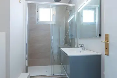 a bathroom with a shower and a sink at Amazing Sea View 2Bdr Swimming Pool Parking in Villefranche-sur-Mer