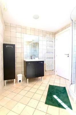 a bathroom with a sink and a tub and a mirror at Villa Soleil d'Or in Villefranche-sur-Mer
