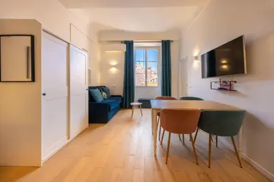 a living room with a couch and a dining room at 06A3 - Lovely apartment in the heart of old Nice in Nice