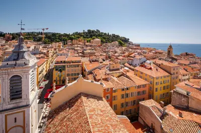 a living room with a blue couch and a table at 06A3 - Lovely apartment in the heart of old Nice in Nice