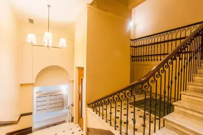 a staircase in a home with yellow walls at PALAIS ALBERT 1ER AP4292 By Riviera Holiday Homes in Nice