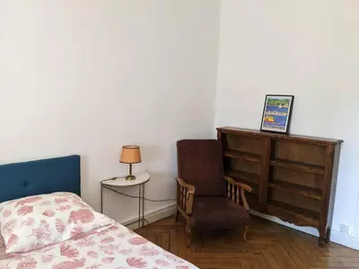 a bedroom with a bed and a chair and a dresser at Amazing 2-bedroom apartment in Nice near the beach in Nice