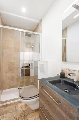 a bathroom with a shower and a toilet and a sink at Nice Renting - CAMBRAI - Luxurious Sea View Terrasse - King Bed - Parking - AC - fully equipped in Nice