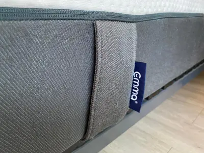 a close up of a mattress with a tag on it at Coquet logement front de mer in Cagnes-sur-Mer