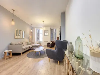 a living room with a couch and a table at Nestor&Jeeves - LE PIERLAS - Place Garibaldi - Very close Old Town in Nice