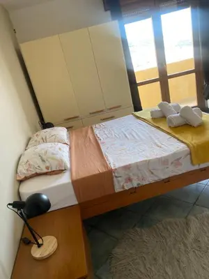 a bedroom with two beds and a desk with a lamp at Appartement 02 Vue Panoramique -WIFI- Parking privé -NICE in Nice
