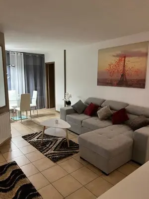 a living room with a couch and a table at Appartement 2 pièces Nice in Nice