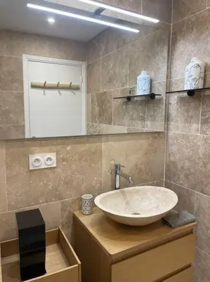 a bathroom with a sink and a mirror at PALAIS ROYAL - Appartement tout confort in Nice