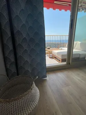 a room with a bed and a window with a view at Exceptional sea view, tennis, parking, WiFi in Nice