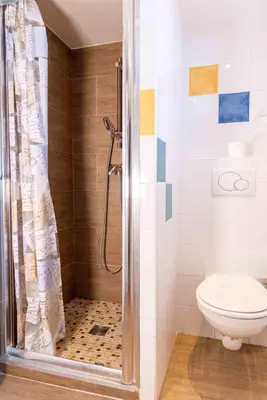 a bathroom with a shower and a toilet at Appartements Vivo in Cagnes-sur-Mer