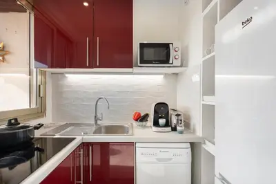 a small kitchen with a sink and a microwave at BLUE LIGHT TERRACE - Nice Port in Nice