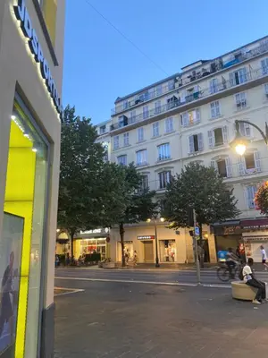 a building on a street in front of a building at Studio sur avenue jean médecin à Nice in Nice