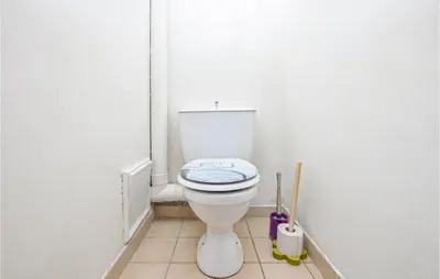 a white bathroom with a toilet in a room at Nice Home In Saint-Jeannet in Saint-Jeannet