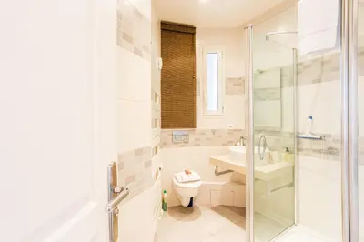 a bathroom with a shower and a toilet and a sink at COSY GARNIER AP4281 by Riviera Holiday Homes in Nice