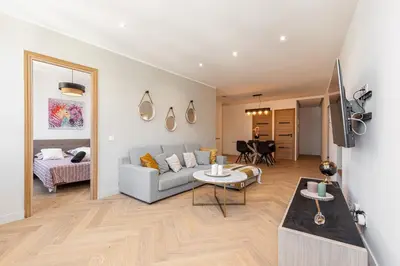 a living room with a couch and a table at Magnifique appartement, Nice Centre Ville - Masséna in Nice