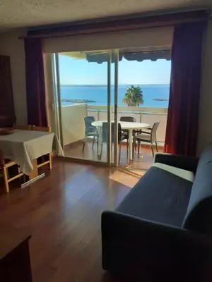 a living room with a view of the ocean at Maeva in Saint-Laurent-du-Var