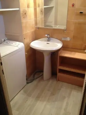 a small bathroom with a sink and a mirror at Maeva in Saint-Laurent-du-Var