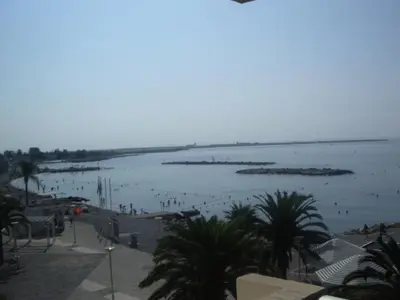 a view of a beach with people in the water at Maeva in Saint-Laurent-du-Var
