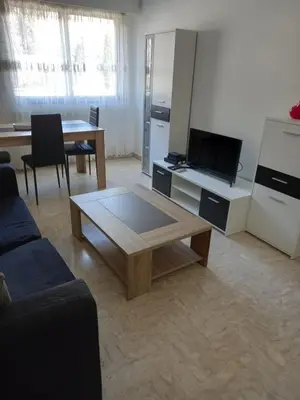 a living room with a couch and a coffee table at Appartement Nice Promenade des Anglais pour 4 personnes in Nice