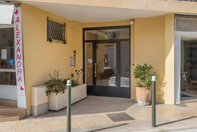 a entrance to a building with a door and plants at 2P neuf au Coeur de St Jean Cap Ferrat in Saint-Jean-Cap-Ferrat