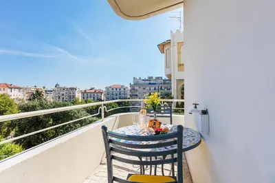 a table and chairs on a balcony with a view at Imperial AP4318 by Riviera Holiday Homes in Nice
