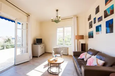 a living room with a couch and a table at Imperial AP4318 by Riviera Holiday Homes in Nice