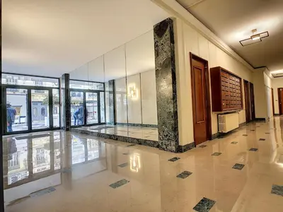 a lobby with a pillar in the middle of a building at Nestor&Jeeves - ANGLICAN TERRASSE - Central - Very close sea in Nice