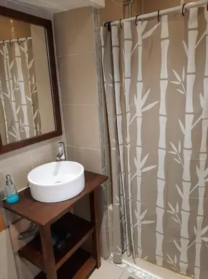 a bathroom with a sink and a shower curtain at Nice, Seaside apartment in Nice