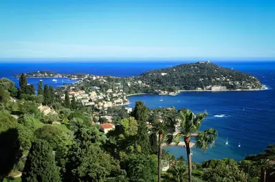 a view of a island with trees and the ocean at Nice, Seaside apartment in Nice